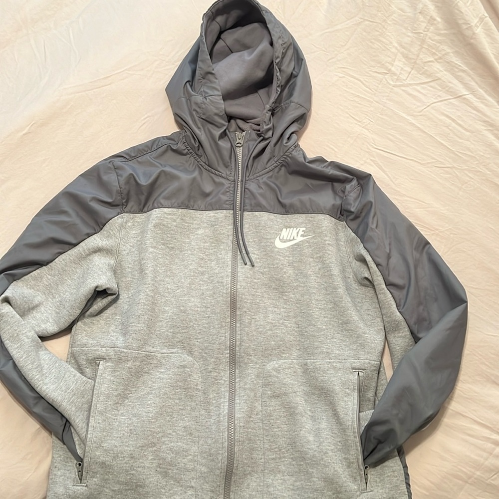 Cold weather Light weighted sports jacket with zipped pockets and cozy hoodie.